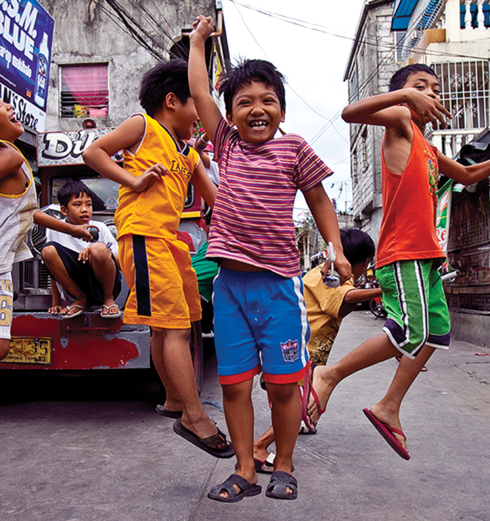 Boys playing in street very happy