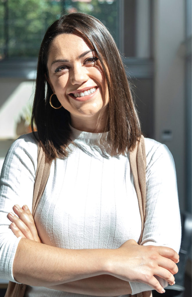 Hispanic Woman smiling in the sunlight