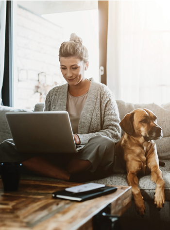 Woman working from home with her dog