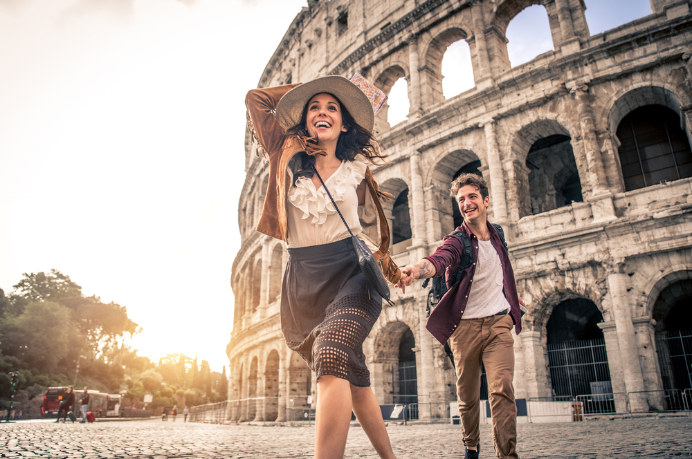 Happy tourists visiting italian famous landmarks